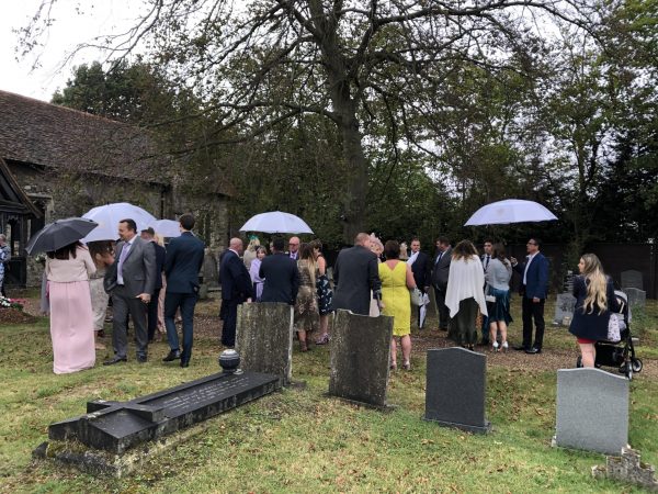 Wedding day weather white umbrellas